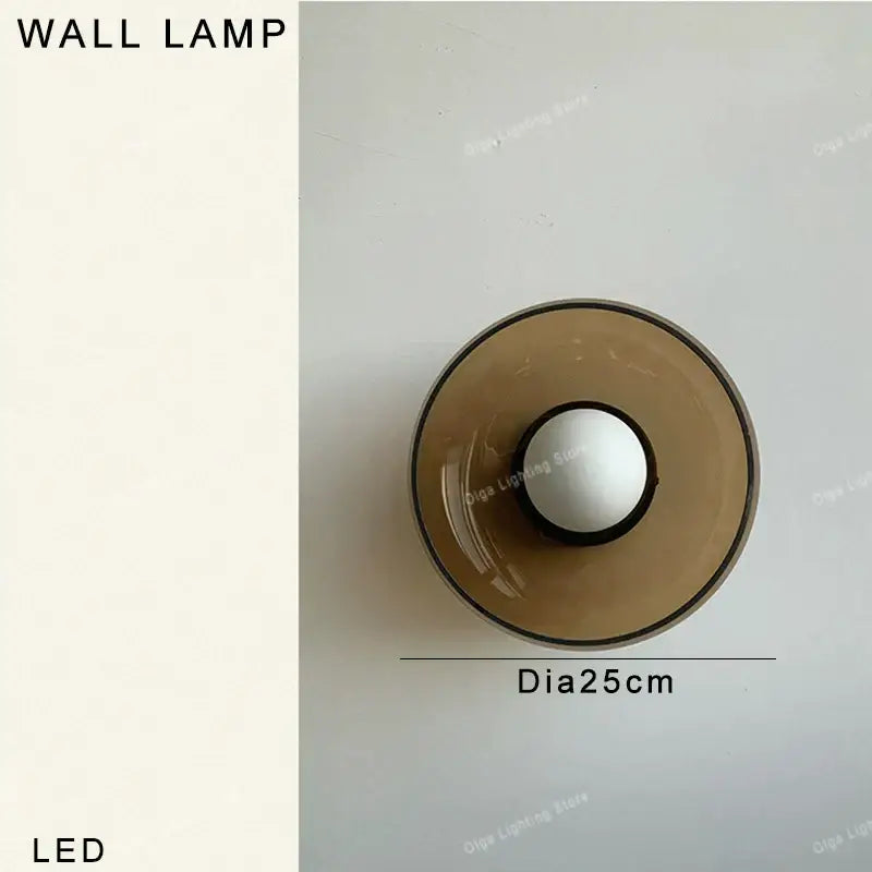Modern minimalist led pendant light with translucent amber green glass shade and white central bulb housing for decorbites amber green decor