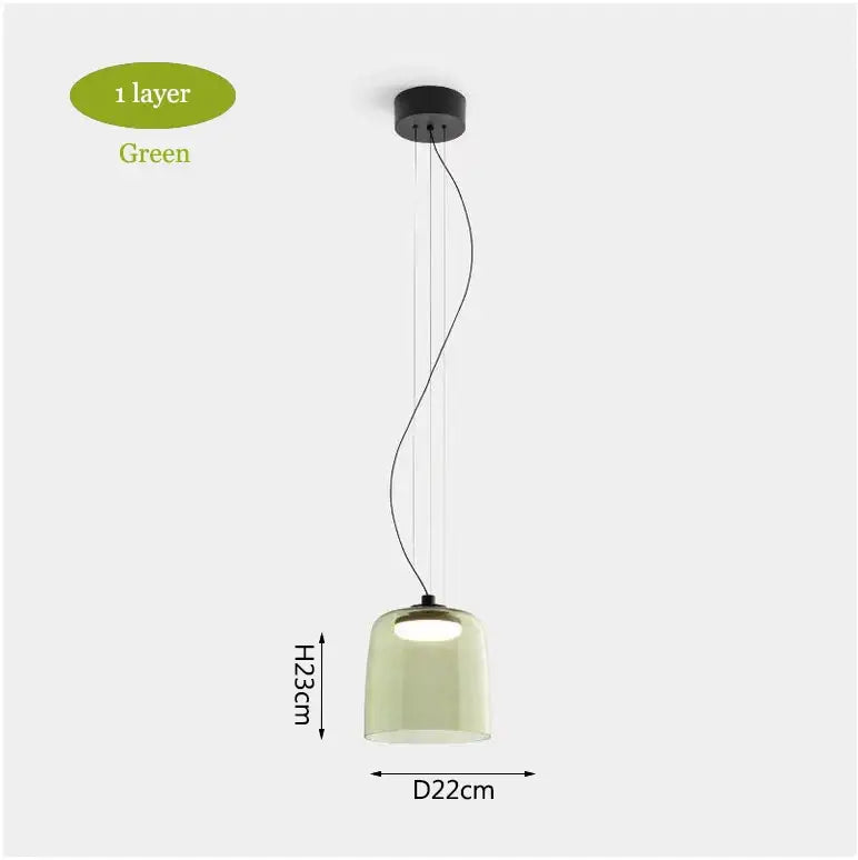 Modern green glass pendant light with sleek black mount and curved cords for dining room chandelier decorbites levels colorful