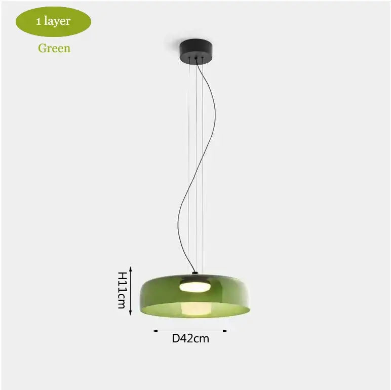 Modern green glass pendant light with sleek black ceiling mount complementing decorbites levels colorful glass design