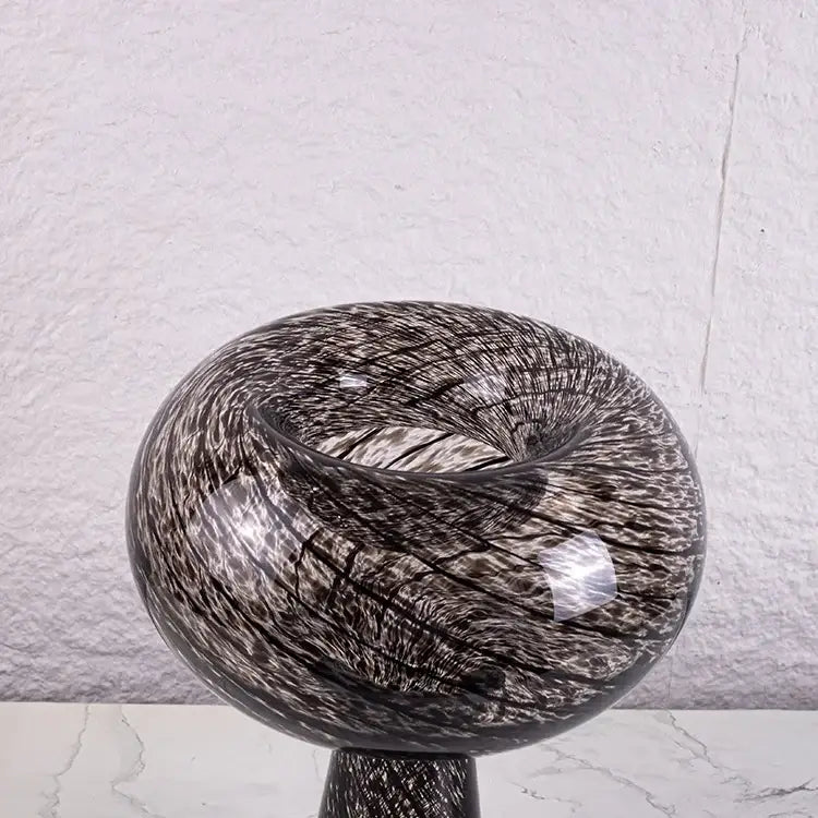 A sleek black and silver geometric glass vase with intricate swirling pattern ideal as a flower arranger decorbites geometric glass decor