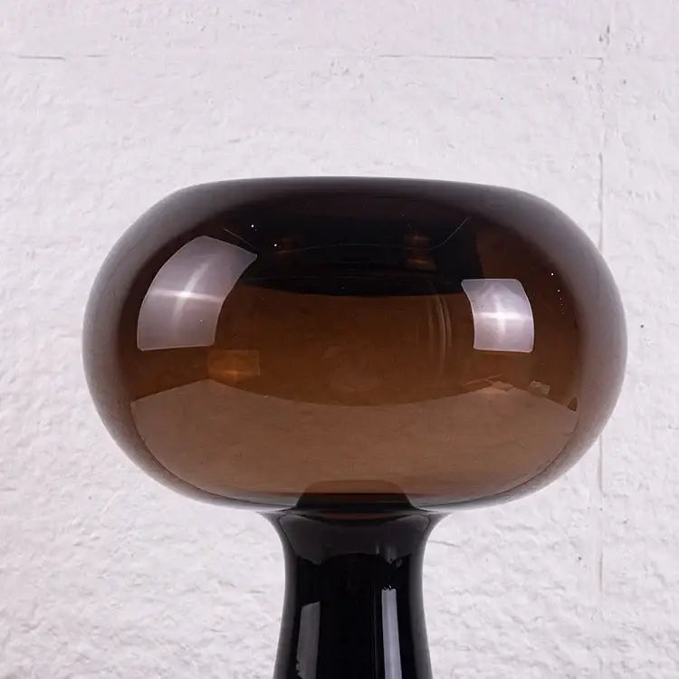 A sleek amber geometric glass vase with glossy finish and slender black stem flower arranger for living room decorbites
