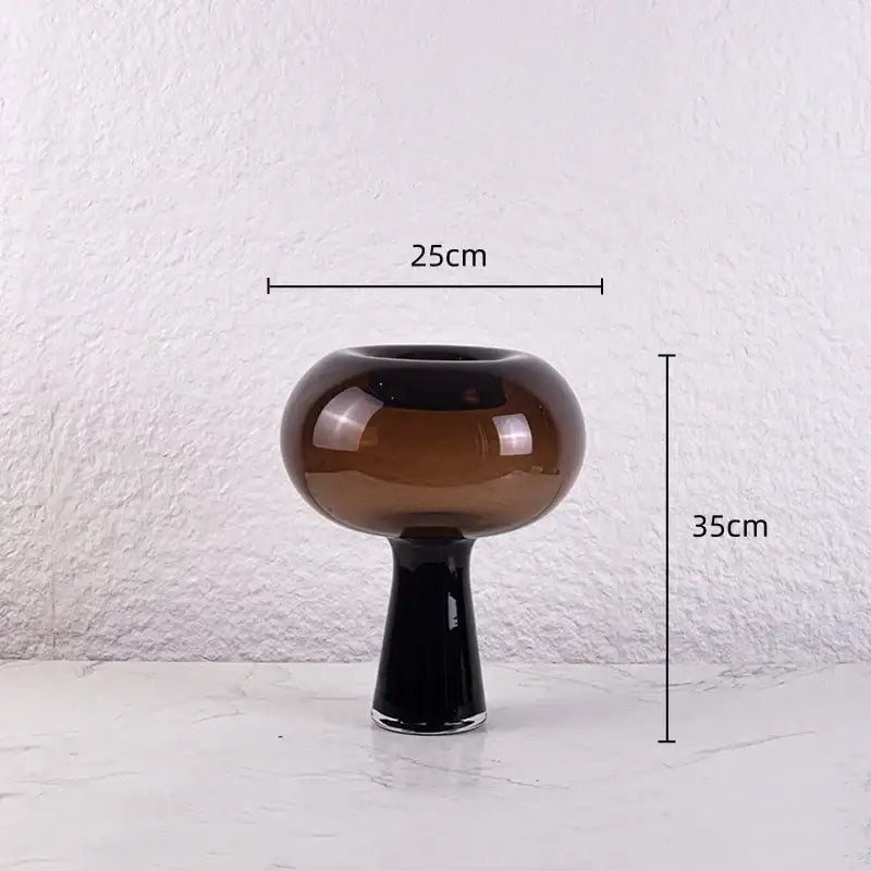 A modern amber and marble geometric glass vase with a glossy black stem flower arranger decorbites geometric glass decor