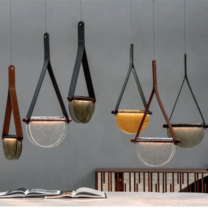 Modern amber and matte gray handmade glass pendant lamp with black metal frame and leather straps for bedroom decorbites handmade glass