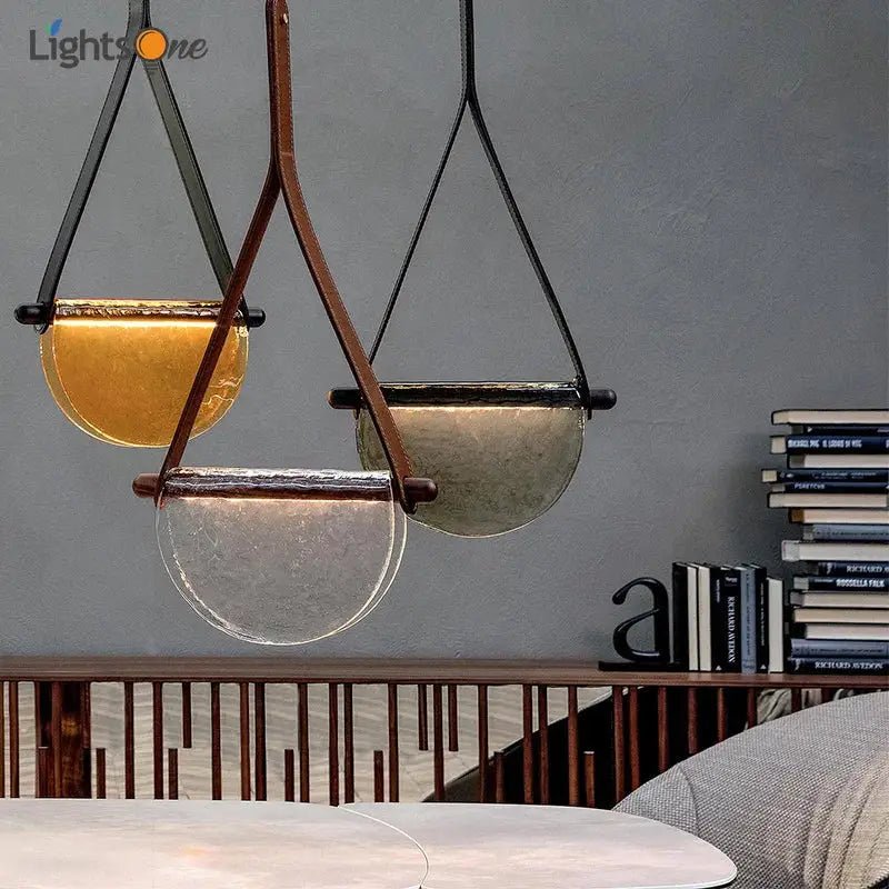 Modern amber and matte gray decorbites handmade glass pendant lamp with semi-circular shades suspended by leather straps