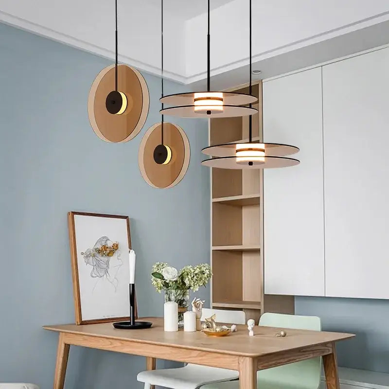 Modern amber smoke gray glass pendant lamp with warm wooden discs and black metal accents for dining room decorbites amber smoke