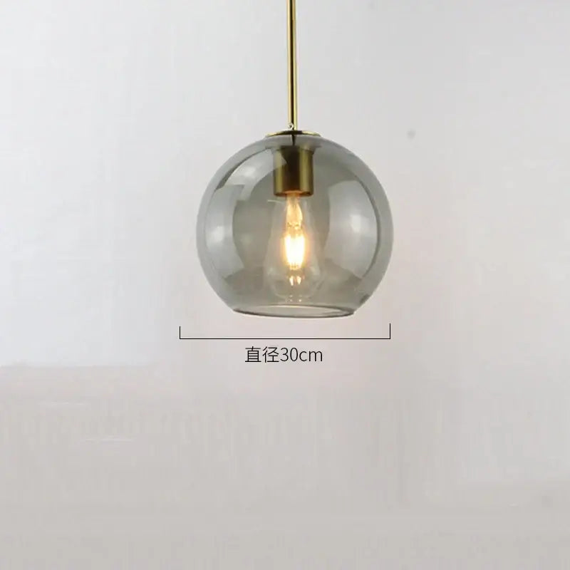 A sleek 30cm amber smoked gray decorbites glass ball led pendant light with brass fixture for dining room decor
