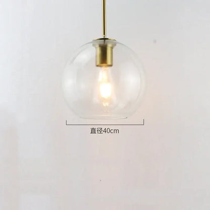 Modern amber smoked gray and clear glass ball led pendant light with clear glass globe and brass-finished metal rod for dining room decorbites glass ball pendant lights