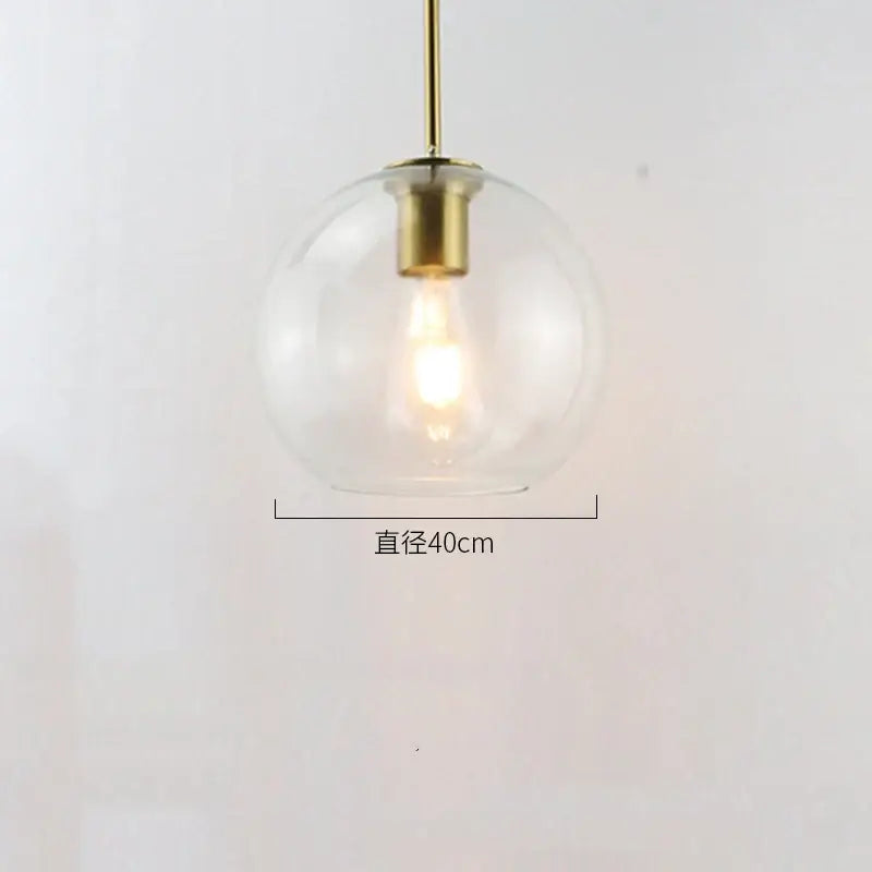 Modern amber smoked gray and clear glass ball led pendant light with clear glass globe and brass-finished metal rod for dining room decorbites glass ball pendant lights