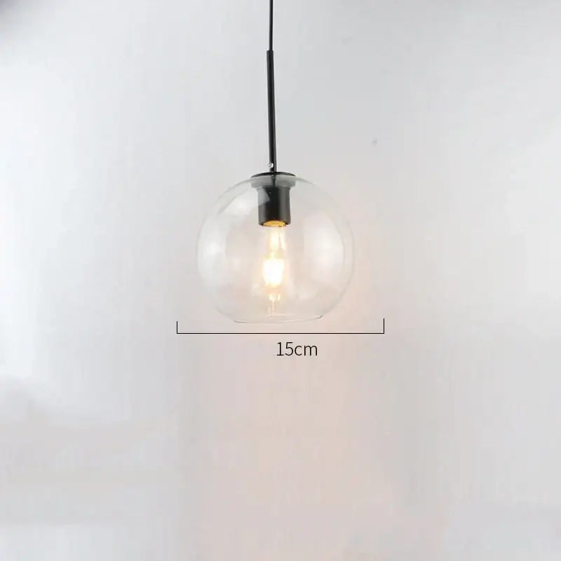 Modern amber smoked gray and clear glass ball led pendant lights with black metal suspension and exposed filament bulb