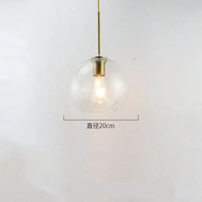 A sleek modern amber smoked gray and clear glass ball led pendant light with brass fixture for dining room decorbites glass ball pendant lights