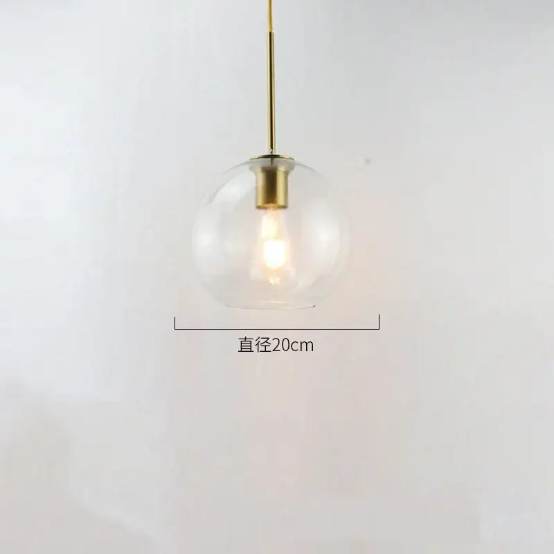 A sleek modern amber smoked gray and clear glass ball led pendant light with brass fixture for dining room decorbites glass ball pendant lights