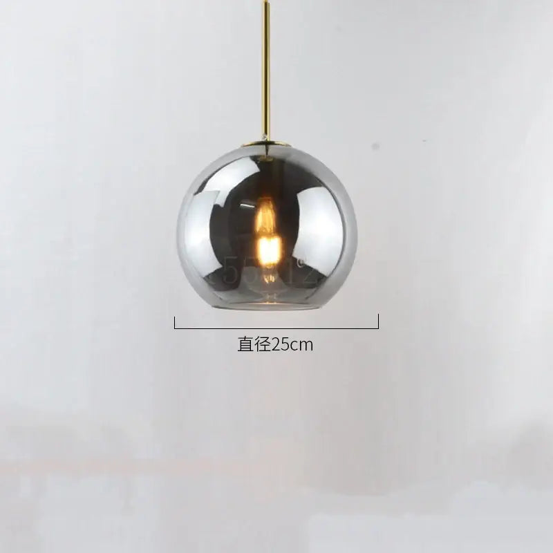 Modern amber smoked gray and clear glass ball led pendant lights featuring a 25cm smoked glass globe and brass rod