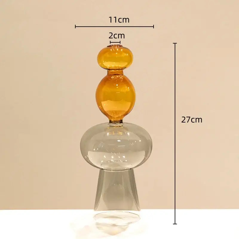 A translucent amber glass vase with stacked spheres and a flared base for modern double glazing stained glass decor