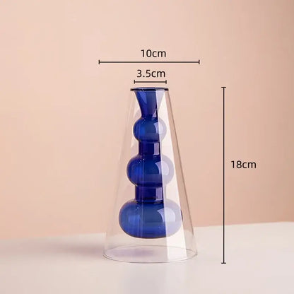 A sleek stained glass vase with double glazing featuring amber and teal colors and three blue spherical sections for living room decor