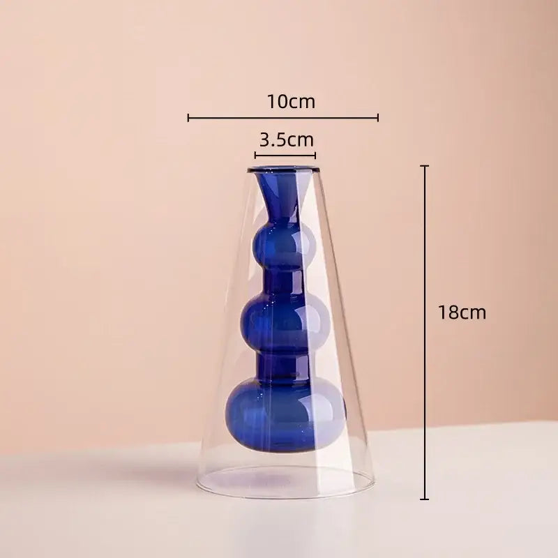 A sleek stained glass vase with double glazing featuring amber and teal colors and three blue spherical sections for living room decor