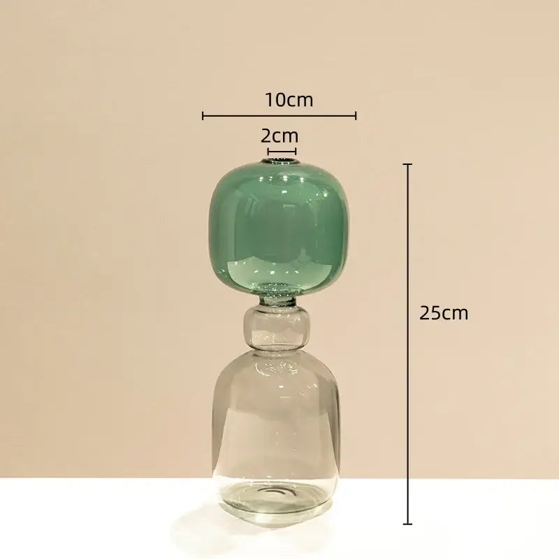 A translucent green stained glass vase with double glazing and a clear glass base for living room decor