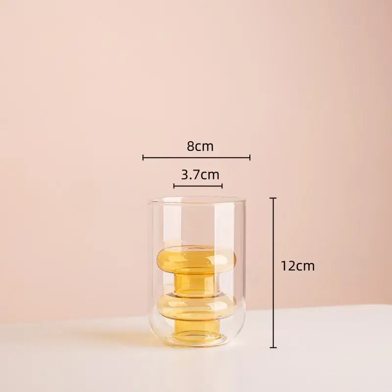 Modern amber and teal double glazing stained glass vase with clear double-walled glass tumbler and stacked rings inside