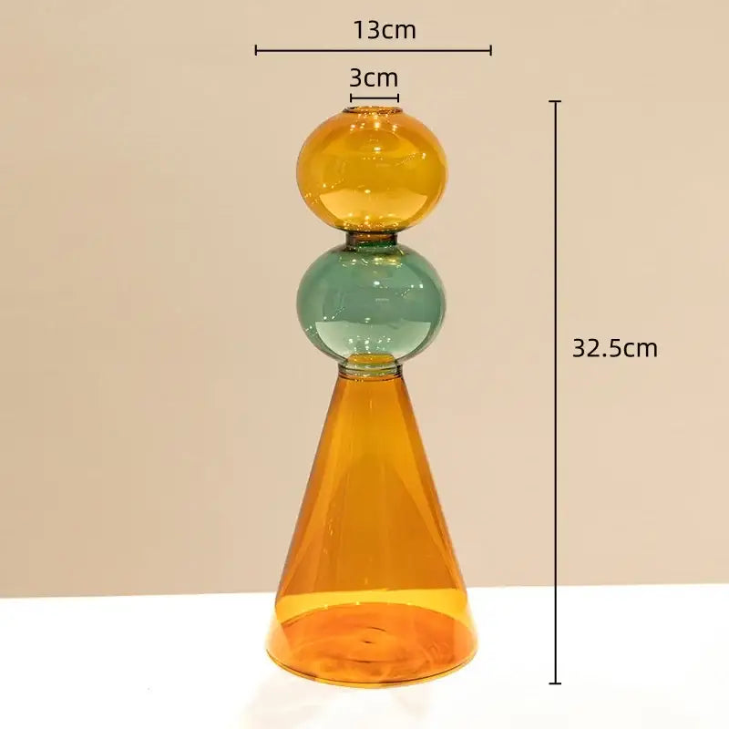A modern stained glass vase with amber cone base teal spherical middle and golden yellow top for living room decor double glazing stained design