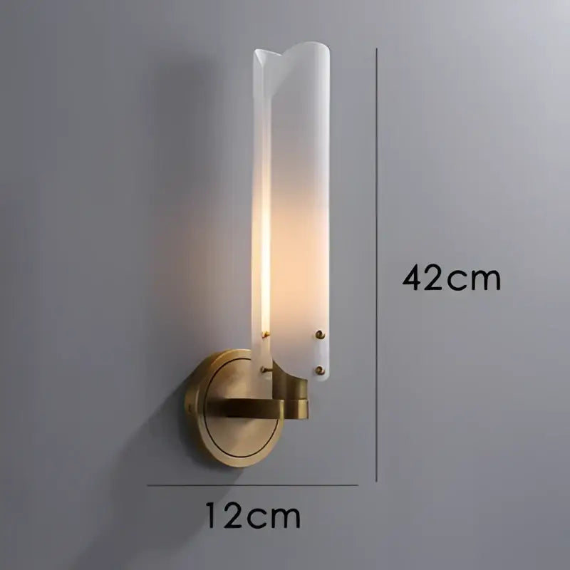 Modern brass-finished led wall sconce with frosted glass shade emitting warm light for bedroom decorbites led wall use