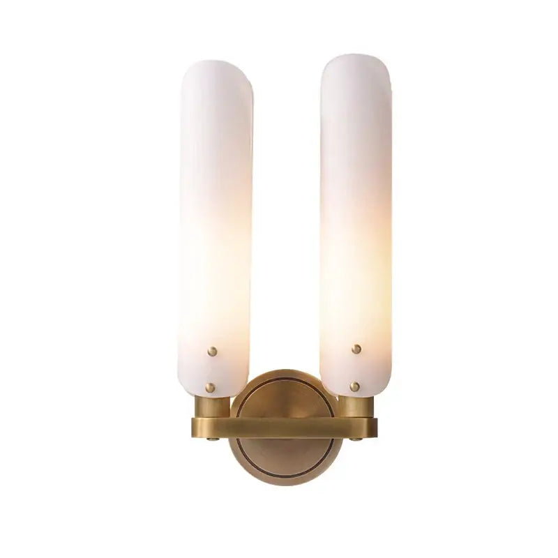 Brass-finished modern amber and white led wall sconce with two frosted glass shades for bedroom decorbites led wall lighting