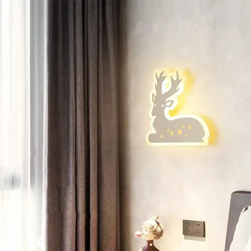 Modern animal acrylic kids led wall light shaped like a glowing deer with gold accents for bedroom decorbites kids led decor