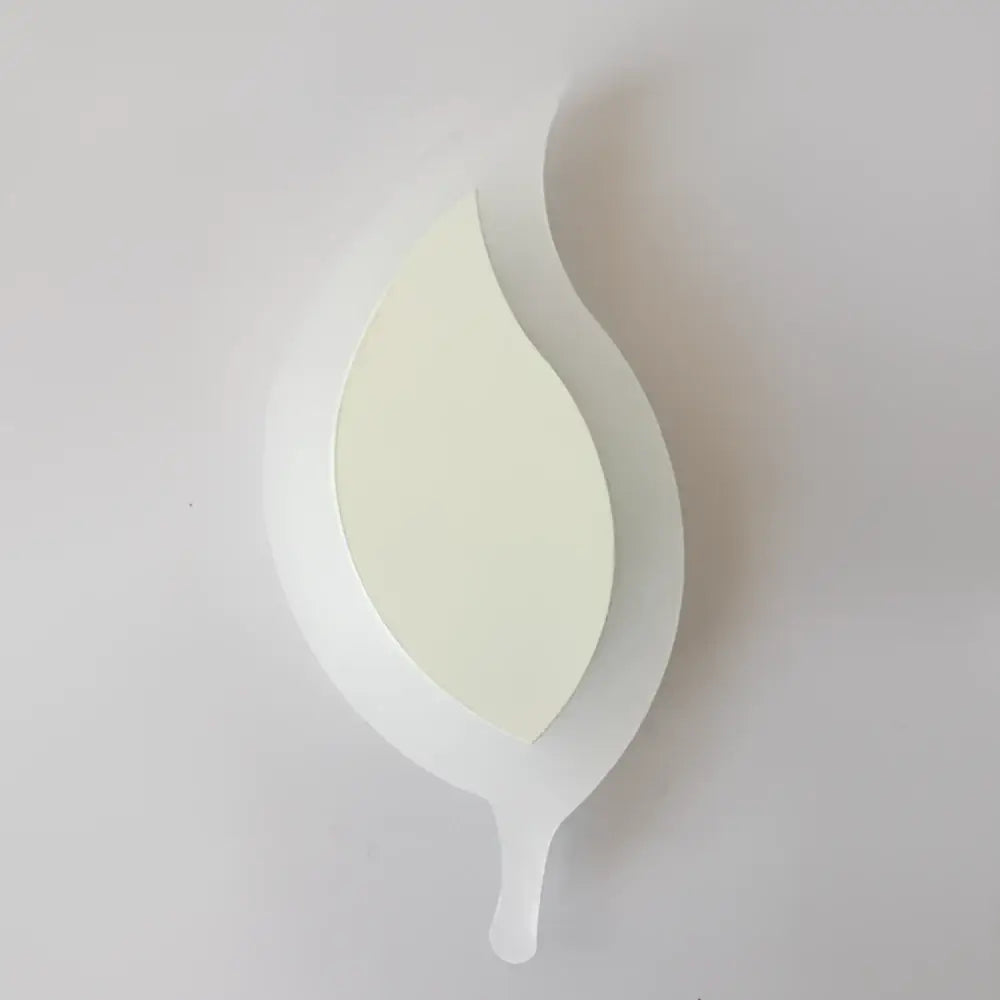 A sleek white acrylic leaf-shaped kids led wall light with a glossy finish for modern bedroom decorbites kids led