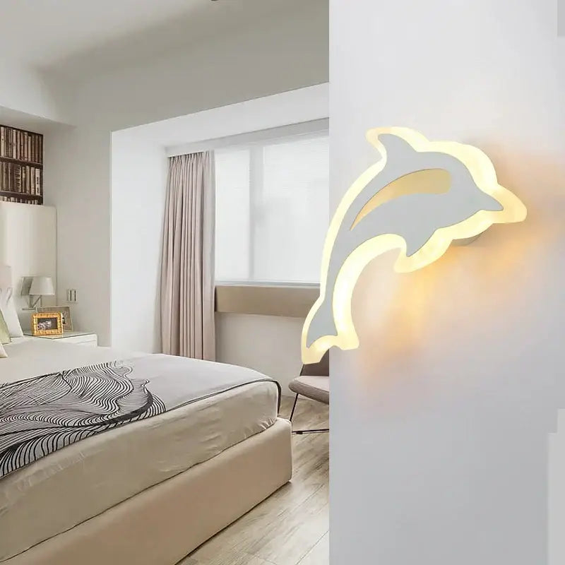 Modern animal acrylic kids led wall light featuring a sleek dolphin-shaped design in glowing white and gray decorbites kids led