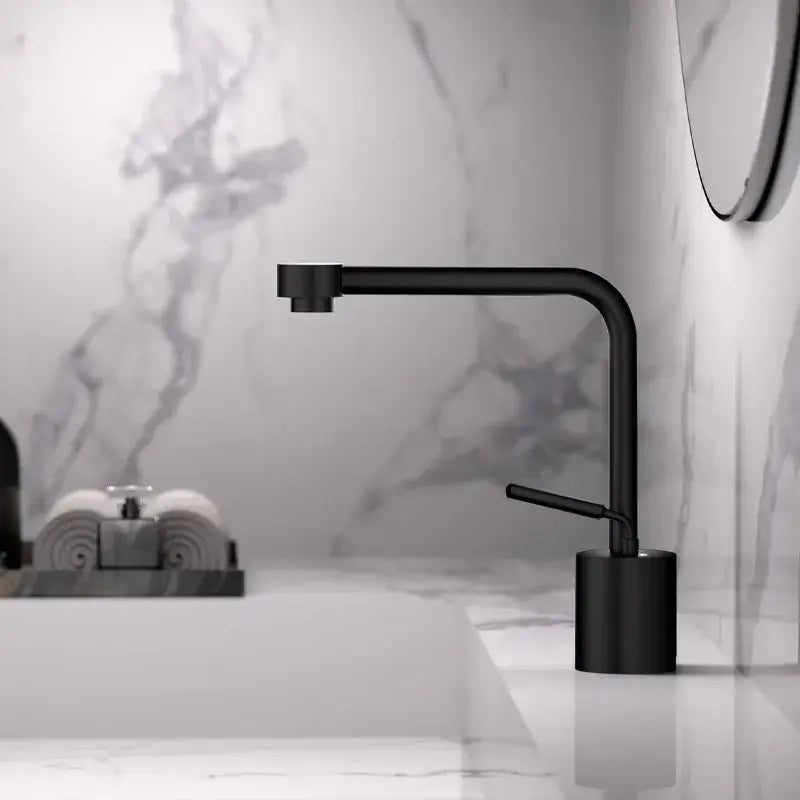 Modern antique bronze curved brass faucet with black matte finish, sleek curved spout, and cylindrical base for bathroom use