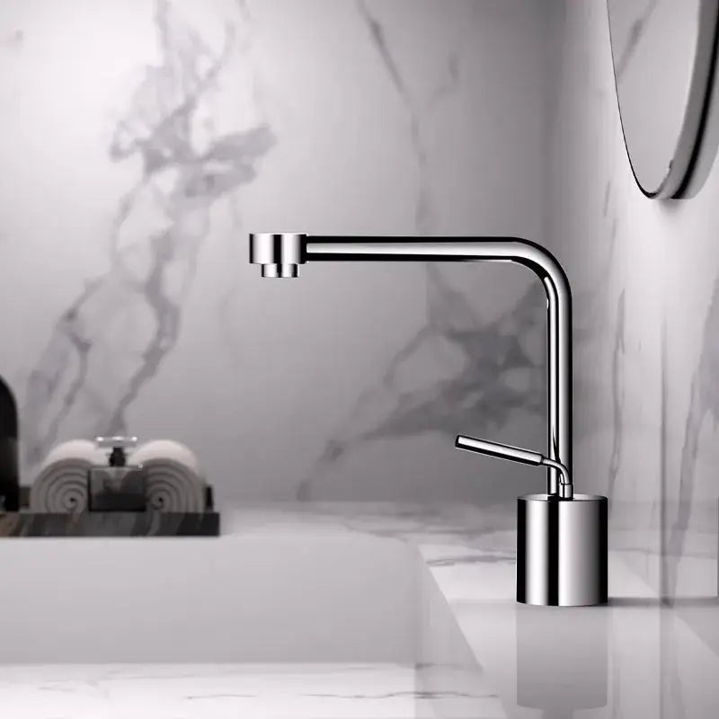 Modern antique bronze curved brass faucet with chrome finish and minimalist cylindrical base for bathroom fixtures
