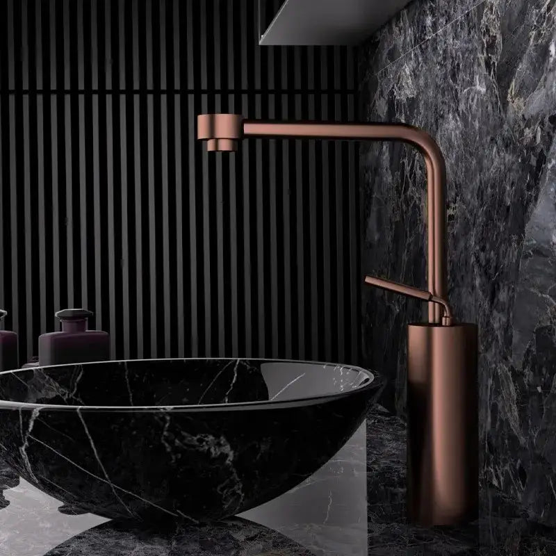 Modern antique bronze curved brass faucet with copper finish and sleek cylindrical base for bathroom fixture use