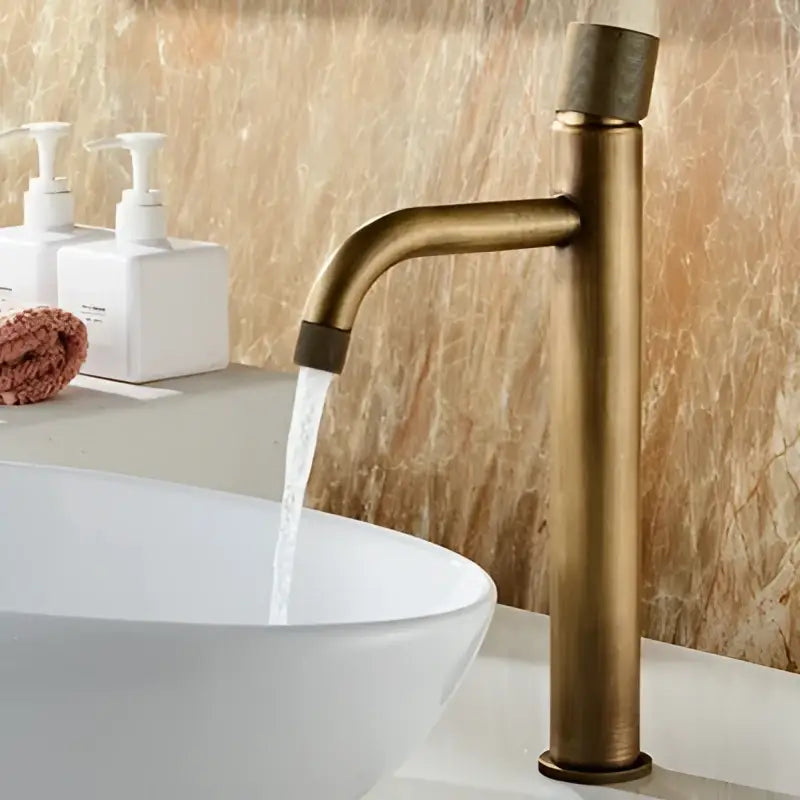 Antique bronze single handle bathroom faucet with sleek modern design and textured grip for cold water use