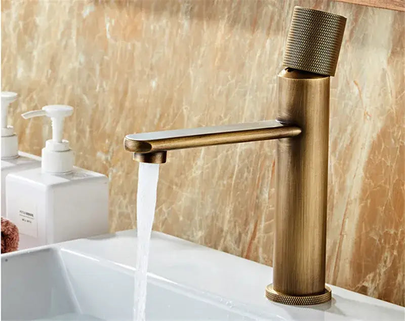 Antique bronze single handle bathroom faucet with textured knurled spout and base for cold water use
