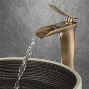Modern antique bronze waterfall mixer faucet with brass finish and sleek design for bathroom cold water use