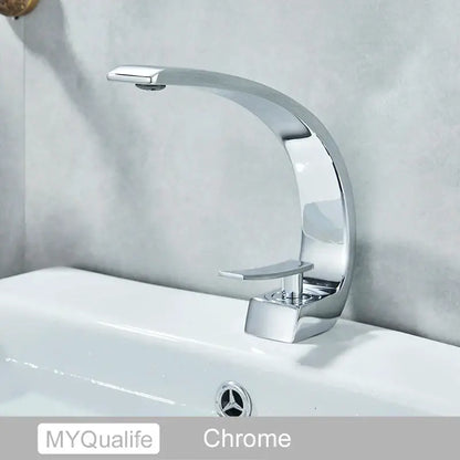 Modern arched brushed gold basin faucet with a chrome-finished sleek curved spout and rectangular handle for bathroom use