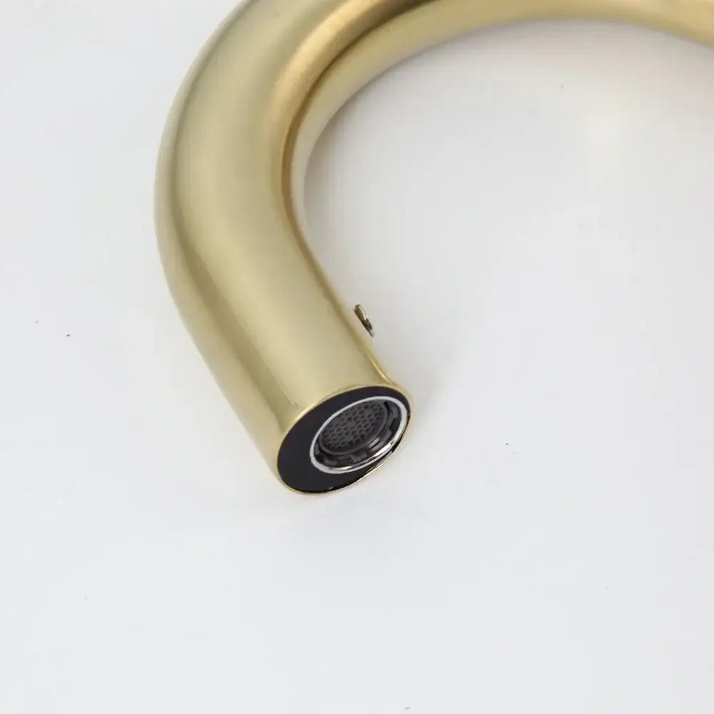 Modern arched brushed gold basin faucet with a brass finish and black rubber seal by decorbites brushed gold collection
