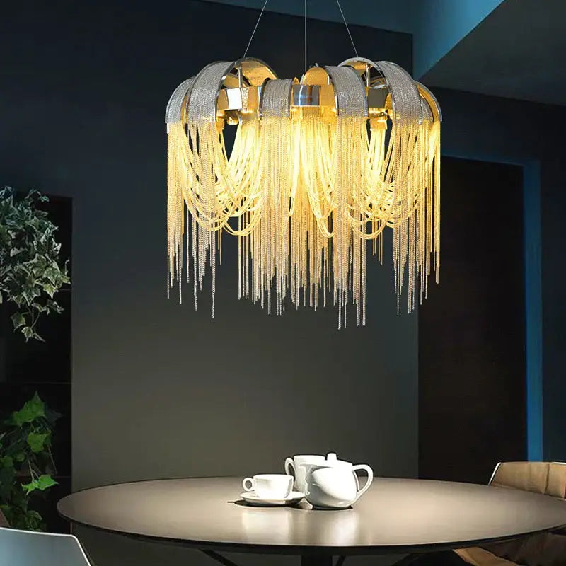 Modern arched gold aluminum chain chandelier with metallic frame and cascading shimmering beads for living room light