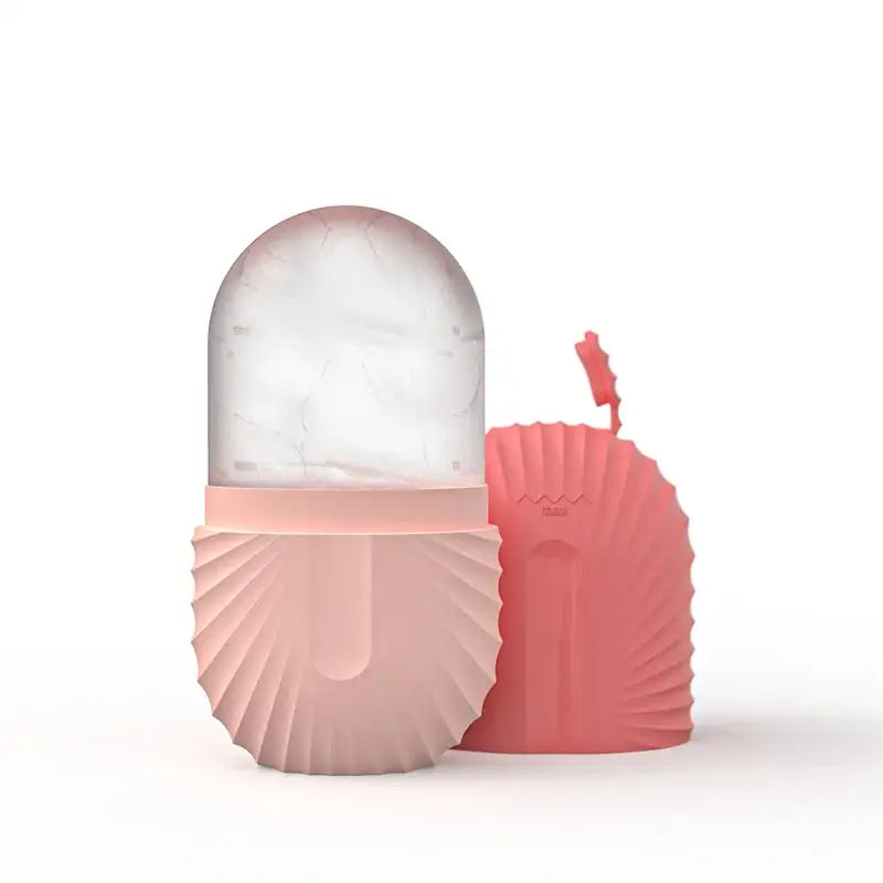 Pink shell-shaped ice pack with clear marble-patterned top section for modern arched pink marble facial roller massager use