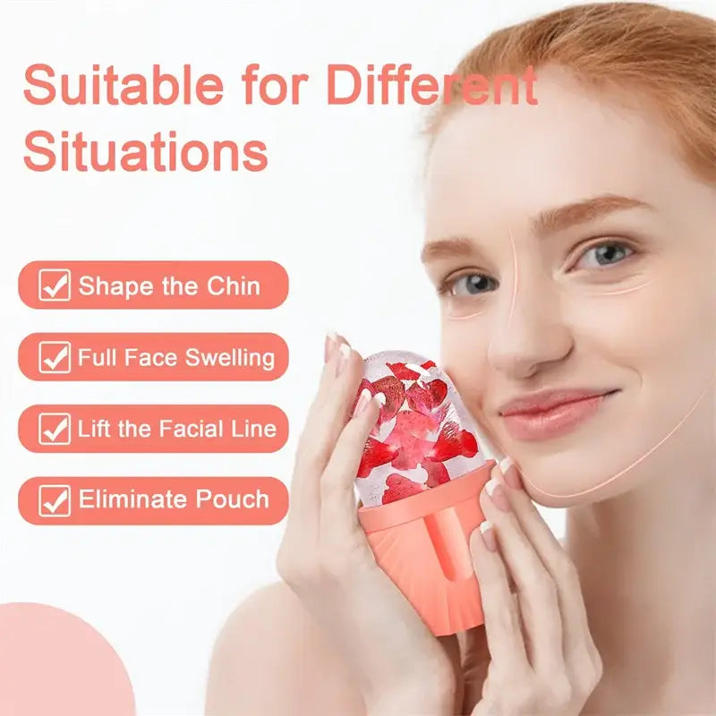 Coral-colored facial roller massager with strawberry-patterned gel top for skin care resembling an ice cube tray design