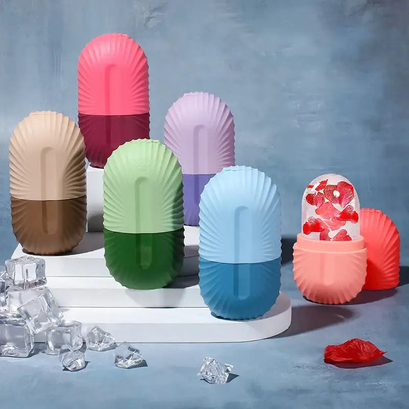 Pastel-colored two-toned silicone ice cube pill shapes and transparent ice cube with rose petals for facial roller massager tool
