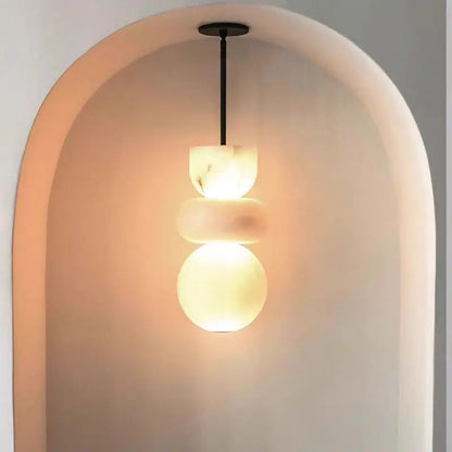 Modern pendant light with three creamy white spanish marble orbs as alabaster indoor ceiling chandelier decor