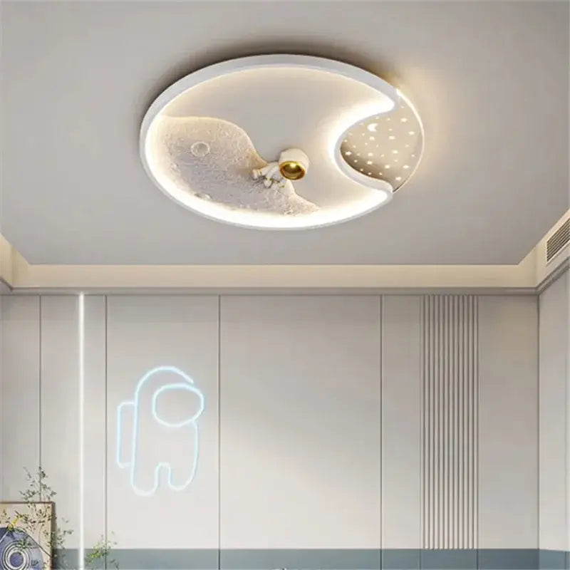 Modern oval-shaped ceiling light with white and gold finish featuring decorbites astronaut moonlight led design for kids room