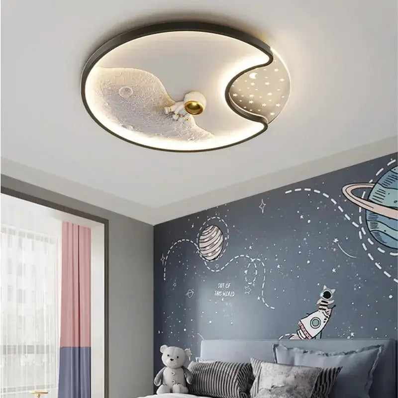 Modern astronaut moonlight led ceiling light featuring a textured moon and gold astronaut for kids bedroom decorbites
