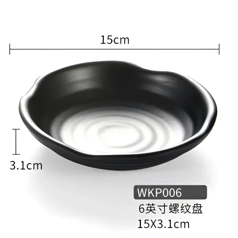 Modern asymmetrical black melamine plastic dipping sauce bowl with smooth glossy finish and subtle concentric ridges interior