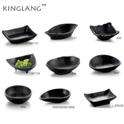 Modern asymmetrical black melamine plastic dipping sauce bowls by decorbites in various shapes and sizes for sushi or appetizers