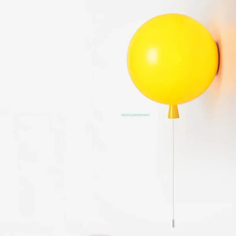 A vibrant yellow balloon wall light with sleek minimalist design ideal for modern bedroom wall lighting