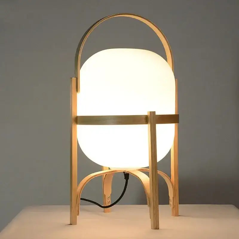 Modern bamboo led desk lamp with warm white spherical glass shade and minimalist curved wooden frame for decorbites bamboo led use