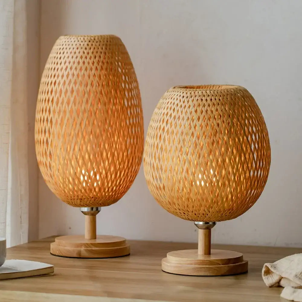 Two warm natural finish bamboo weave table lamps with diamond-patterned mesh design for modern bedroom use