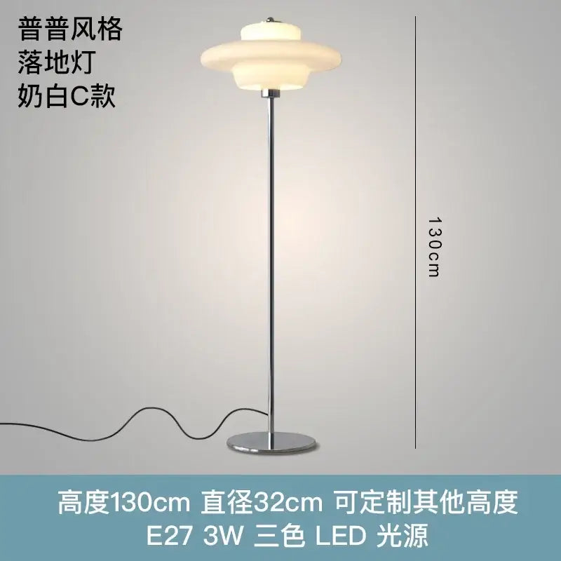 A sleek modern floor lamp with cream glass bauhaus shade and chrome pole for living room decorbites cream glass lighting