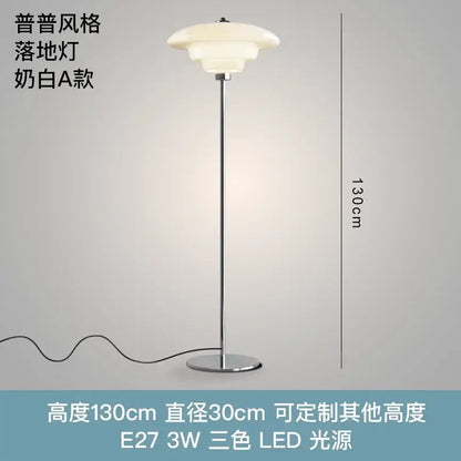 A sleek 130cm tall floor lamp with polished chrome stand and decorbites cream glass bauhaus shade for living room lighting