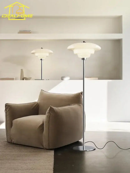Modern bauhaus cream glass floor lamp with sleek chrome stand and layered translucent shades for living room decorbites cream glass